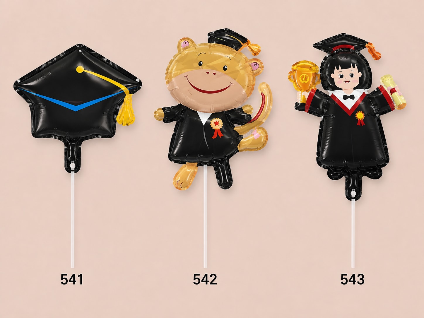 Three graduation-themed foil balloons on sticks, including a cap and two character balloons.
