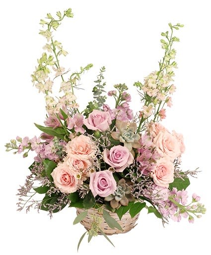 Basket arrangement of pink roses and lavender flowers
