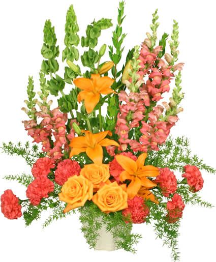 Tall floral arrangement with orange lilies, yellow roses, and pink snapdragons