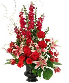 Red roses and lilies in a black vase