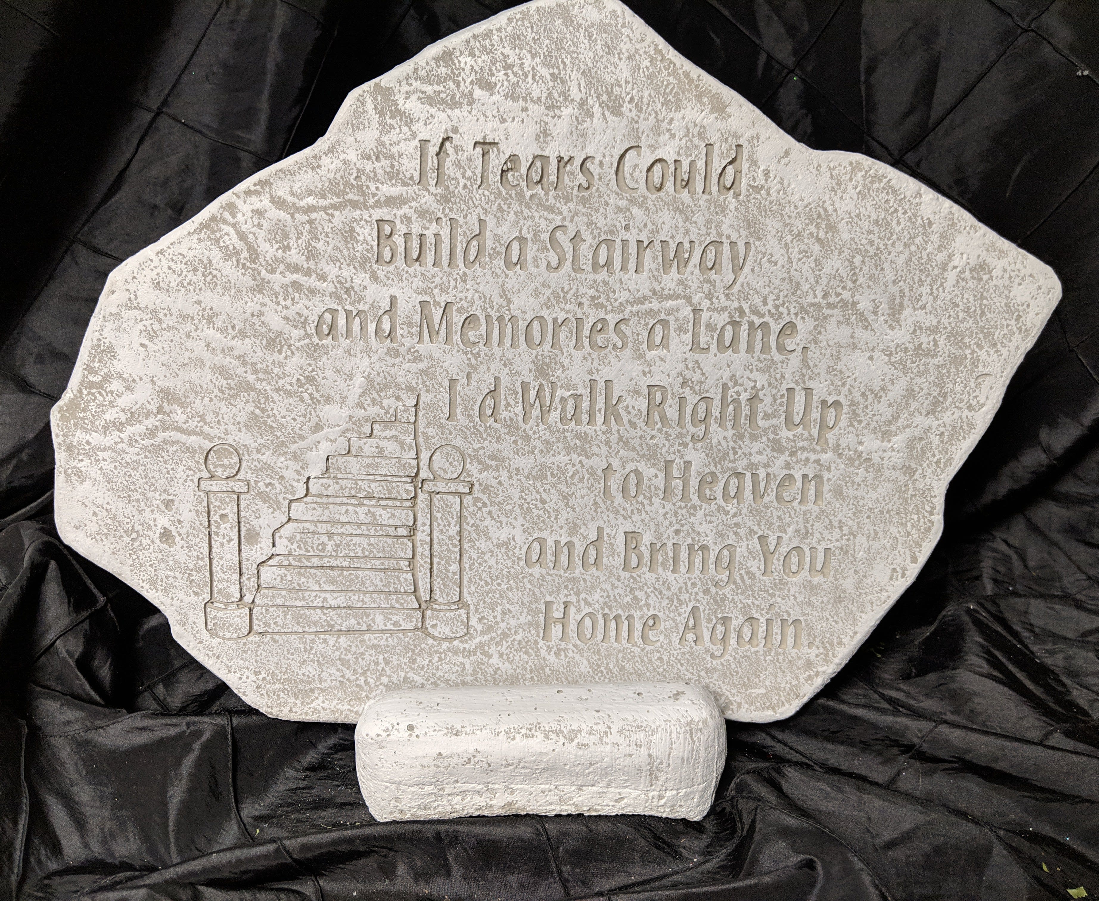 Memorial stone with engraved staircase and verse on a stand