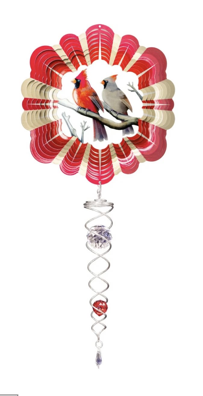 Decorative hanging ornament with two birds and red fan-shaped accents