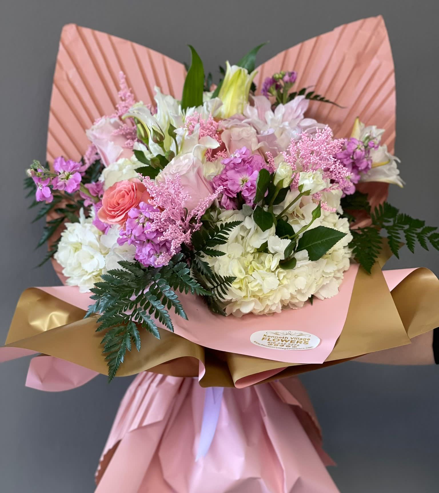 Pink and white mixed bouquet wrapped in pink and gold paper