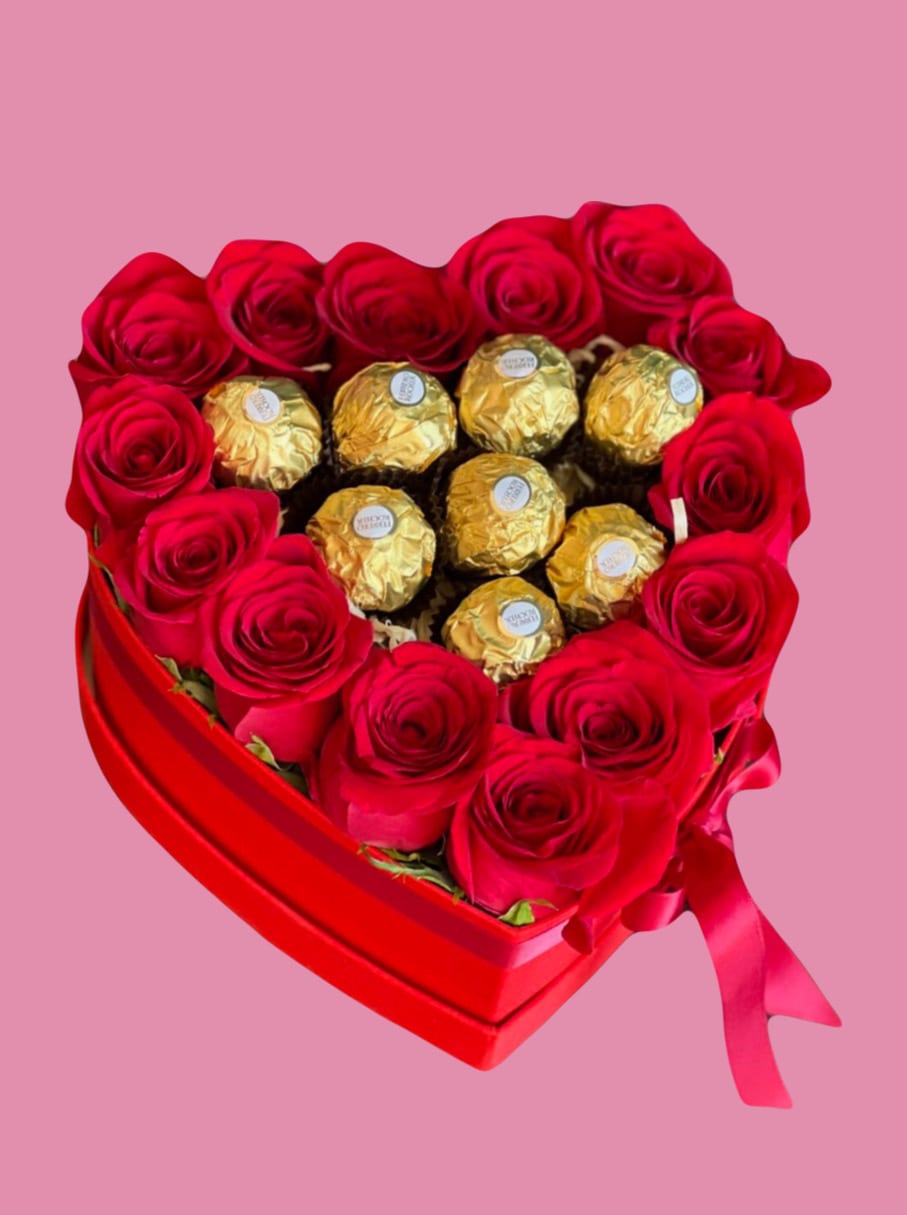 Heart-shaped box of red roses with gold-wrapped chocolates