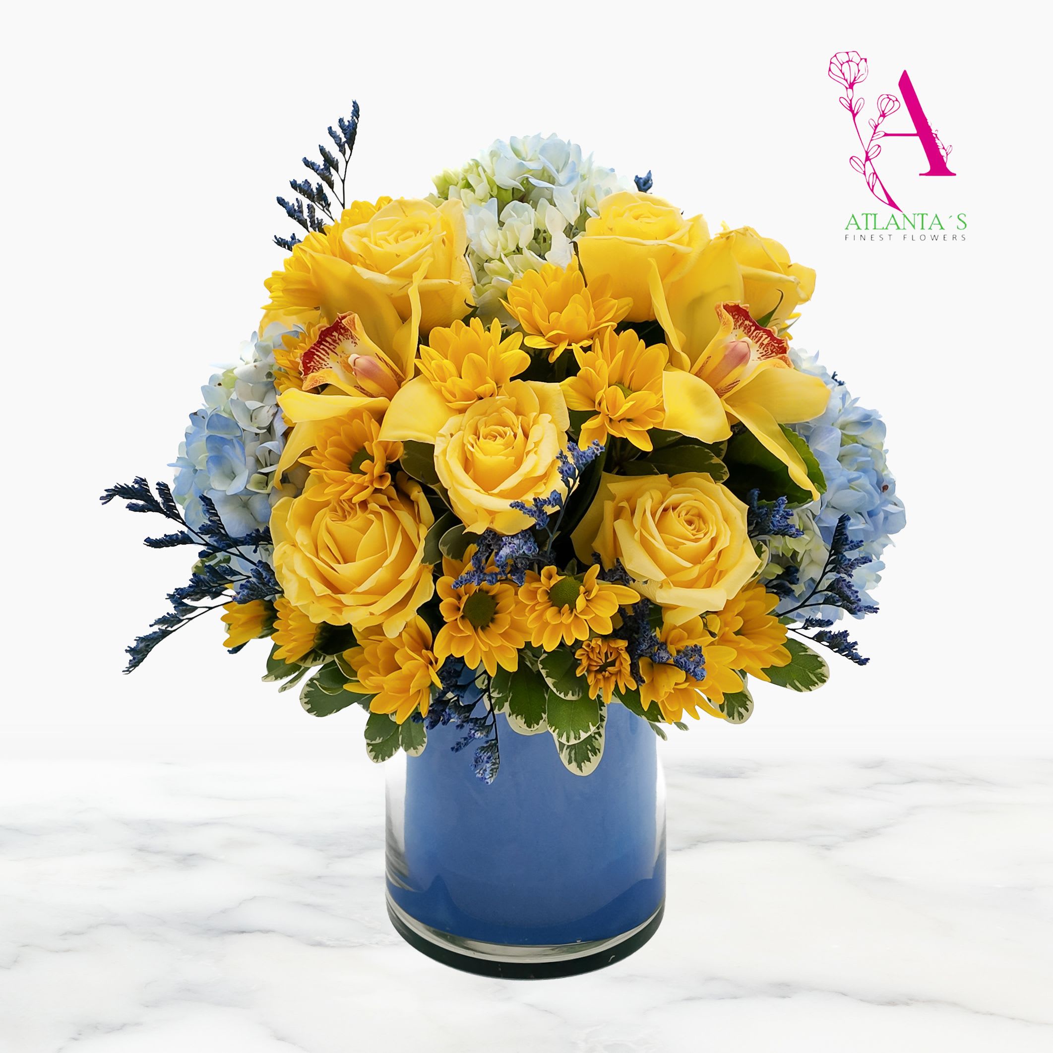 Yellow roses and orchids arranged in a blue vase