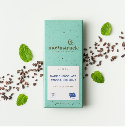 Mint chocolate bar with cocoa nibs and mint leaves
