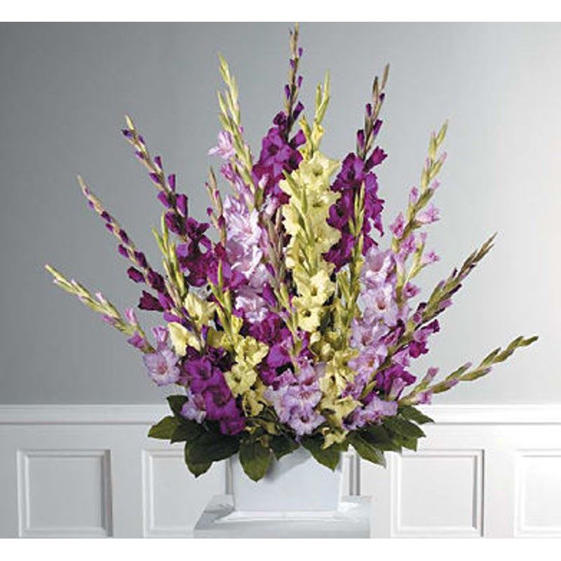 Glads Galore - A fan shaped mache with all glads in shades of purple,lavender and yellow. 