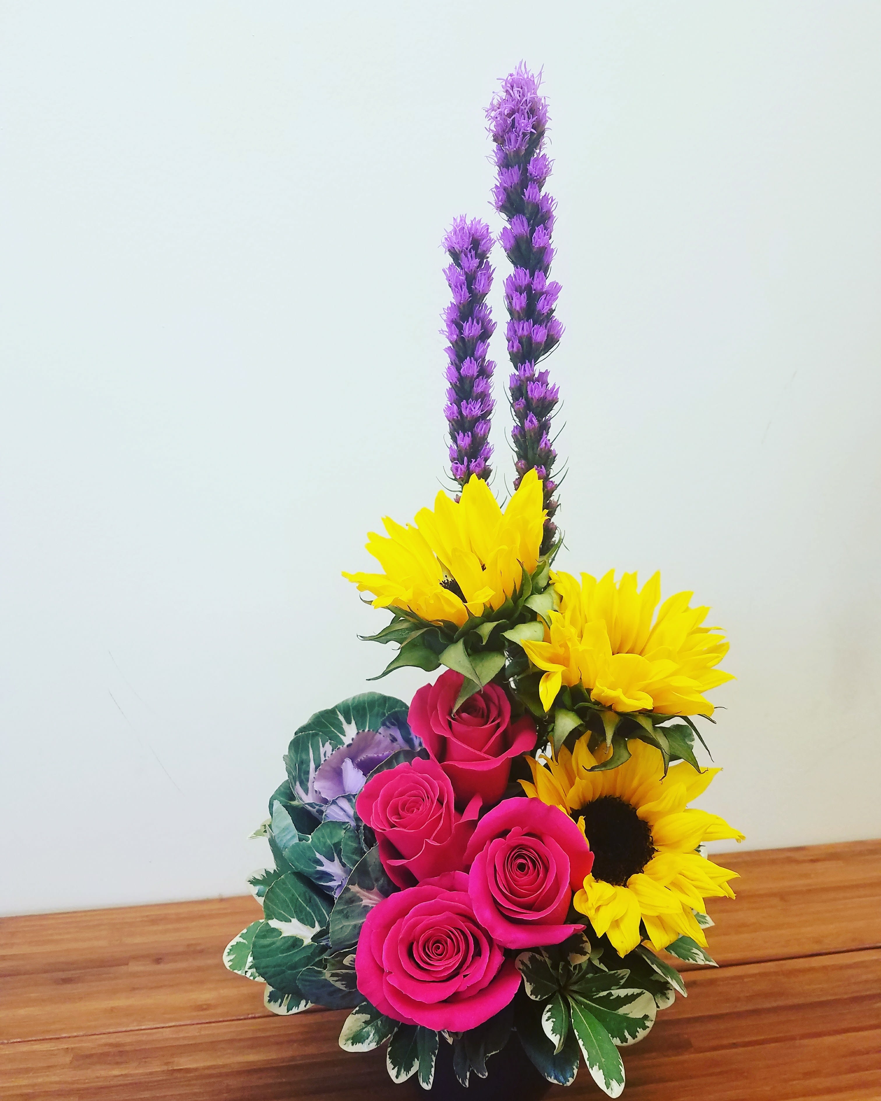 Artfull florals By Purple Orchid Flowers - Artful arrangement of fresh flower of Sunflowers, roses, Liatris, Kale 