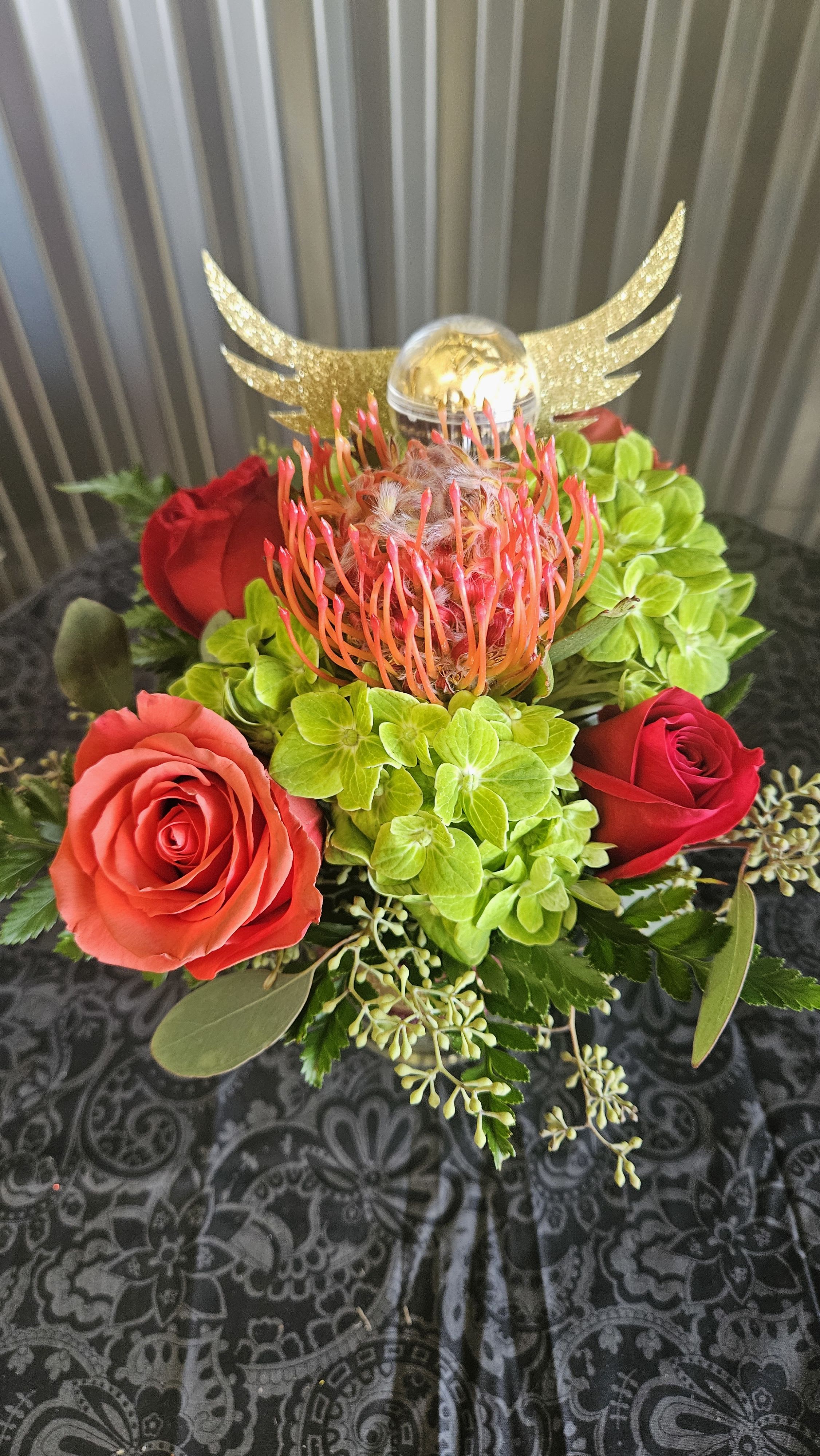 Golden Snitch Arrangement  - Do they just love Harry Potter. Here is an arrangement for them. We made Golden Snitches out of Roche candies 