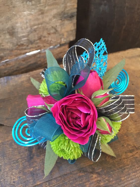 Bright pink rose with lime green and blue ribbon accents