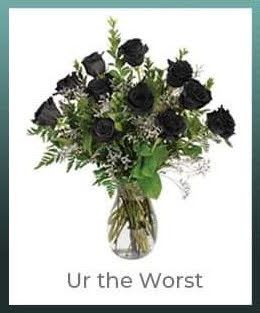 Bouquet of black roses in a clear glass vase with text below