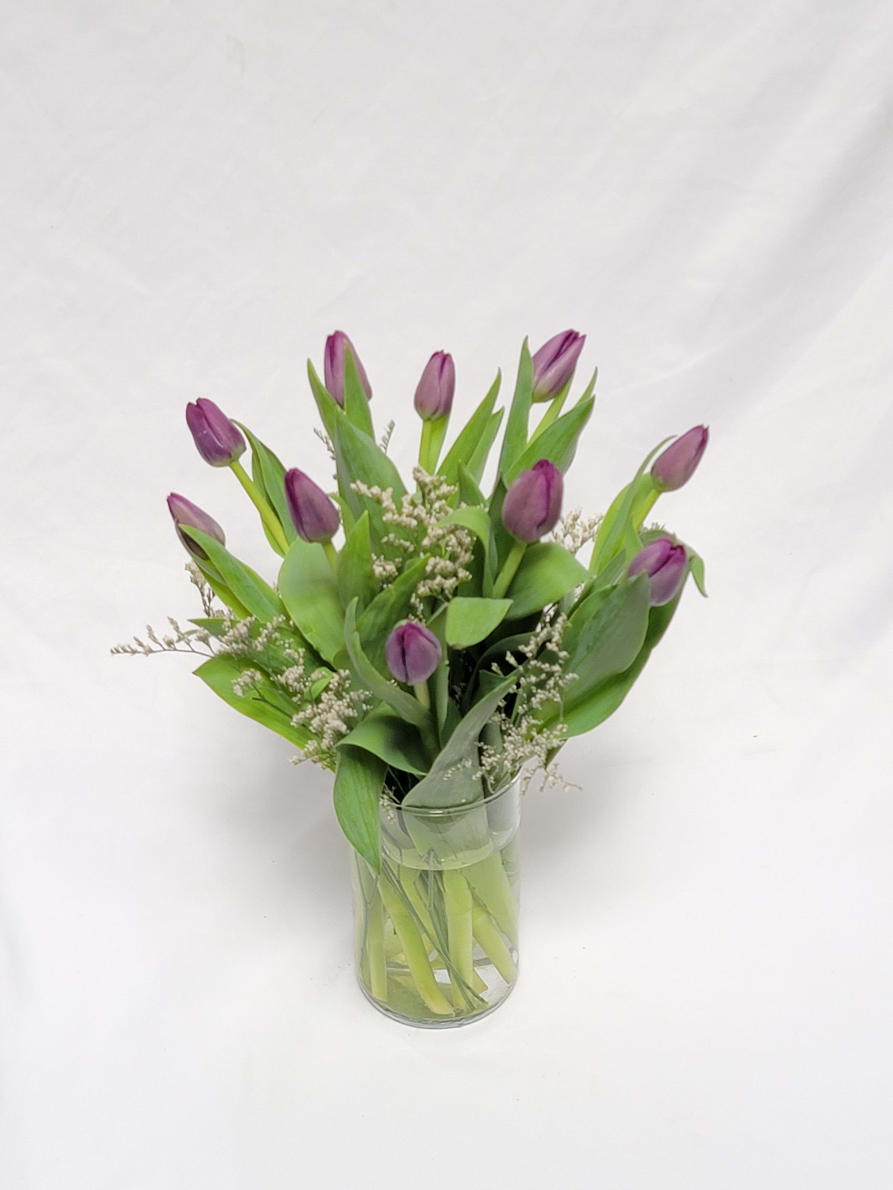 Passionate Purple Tulips - For anyone who's passionate about purple this majestic arrangement of the prettiest purple tulips is well…. Approximately 12 1/2" W x 14 3/4" H Orientation: All-Around 