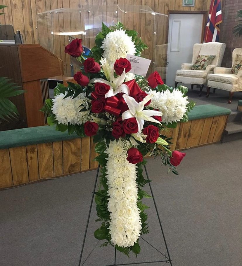 Standing floral cross with red roses and white flowers