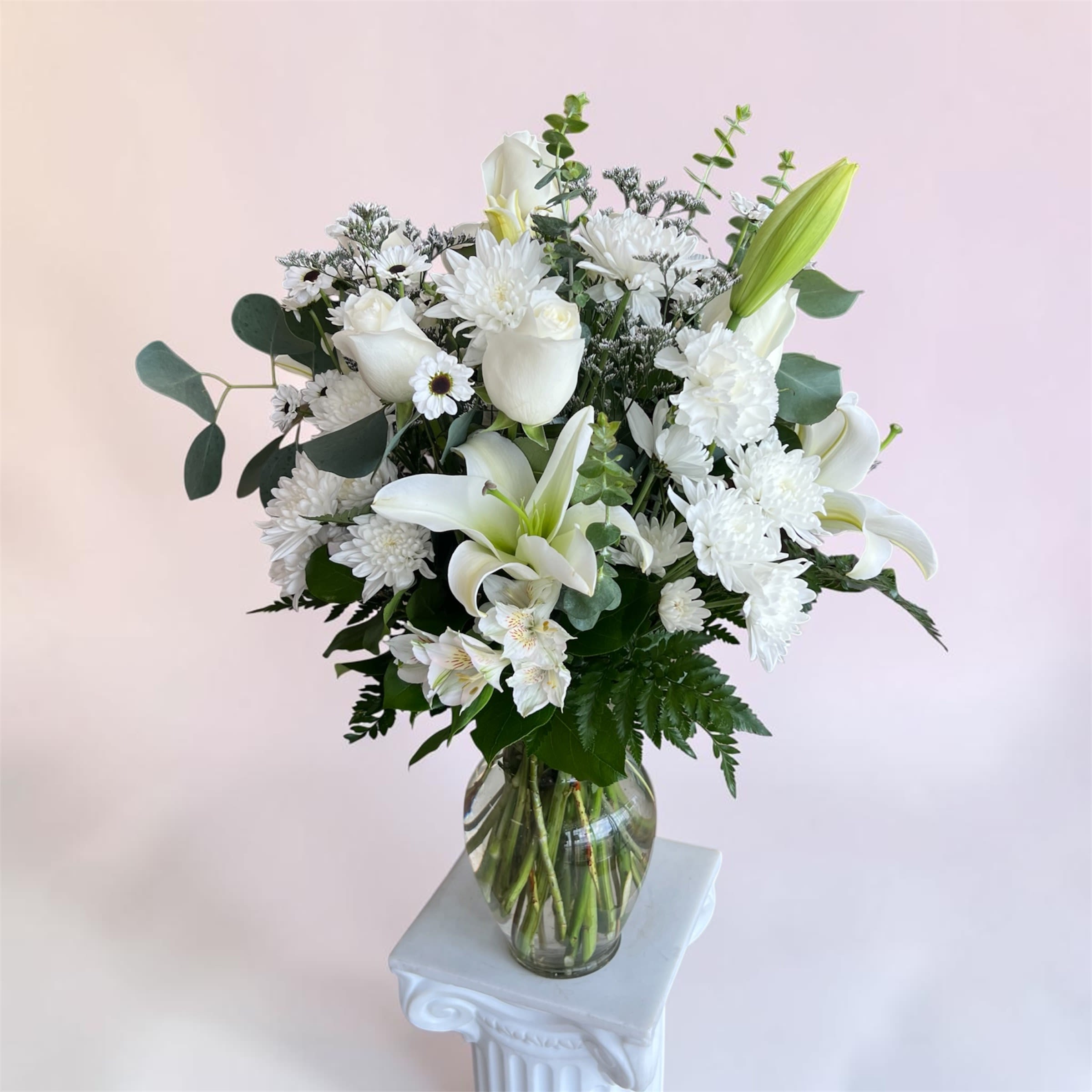 The White Mixed Vase  - Our "White Mixed Vase Arrangement" is perfectly designed for ANY occasion! Ideal for someone who appreciates understated beauty, this arrangement is a meaningful way to mark a wedding, offer condolences, say thank you, wish a happy birthday, or simply let someone know you're thinking of them! 