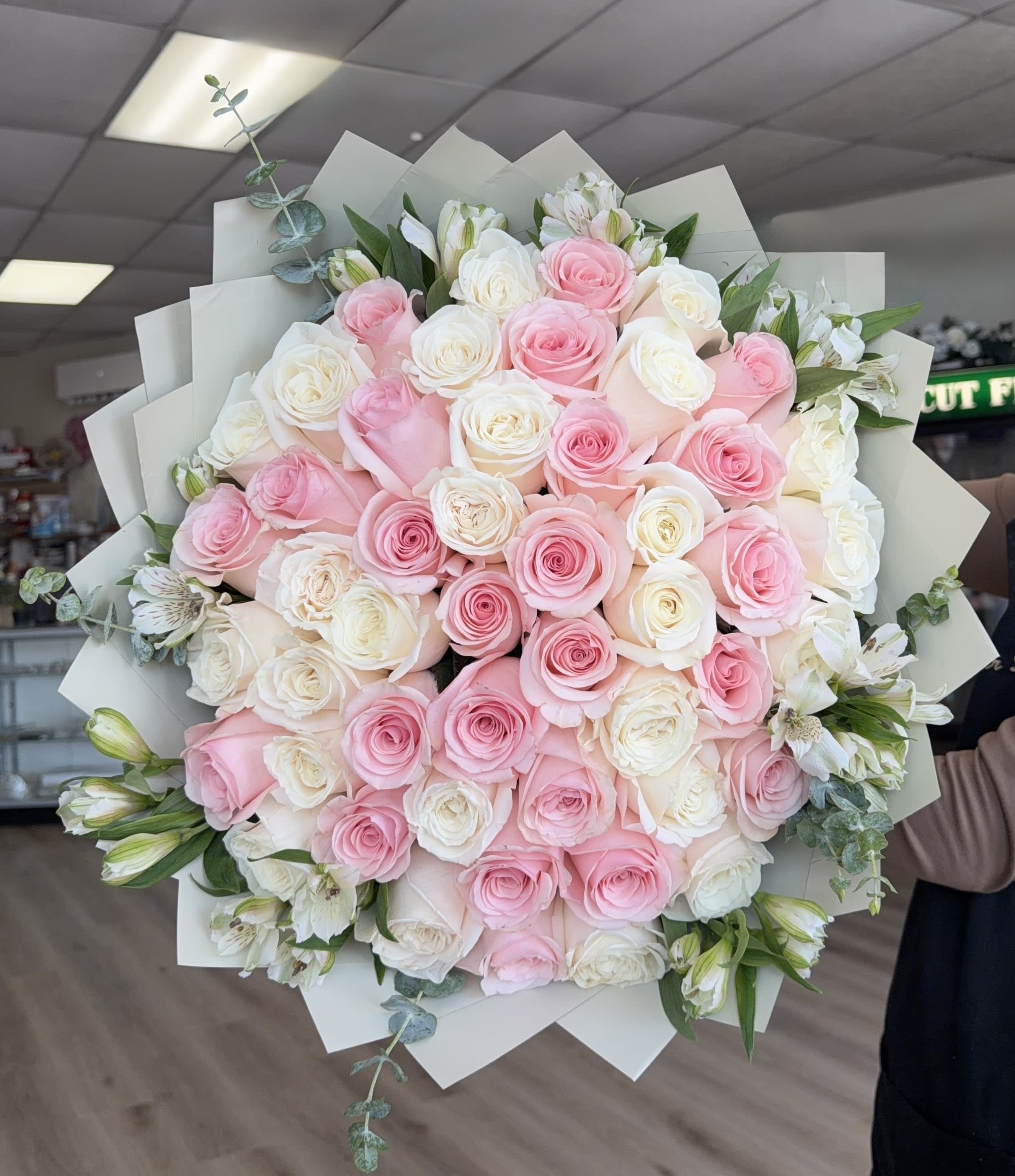 Pink Promise Bouquet  - (DELUXE BOUQUET SHOWN IN PICTURE)  Soft blush roses and creamy ivory blooms form a lush, hand-held promise-perfect as a birthday bouquet or an anniversary roses gift that will make her feel genuinely seen. This romantic flower arrangement reads feminine and timeless, a comforting way to say "I'm thinking of you" for celebrations, heartfelt apologies, or to mark a tender moment! 