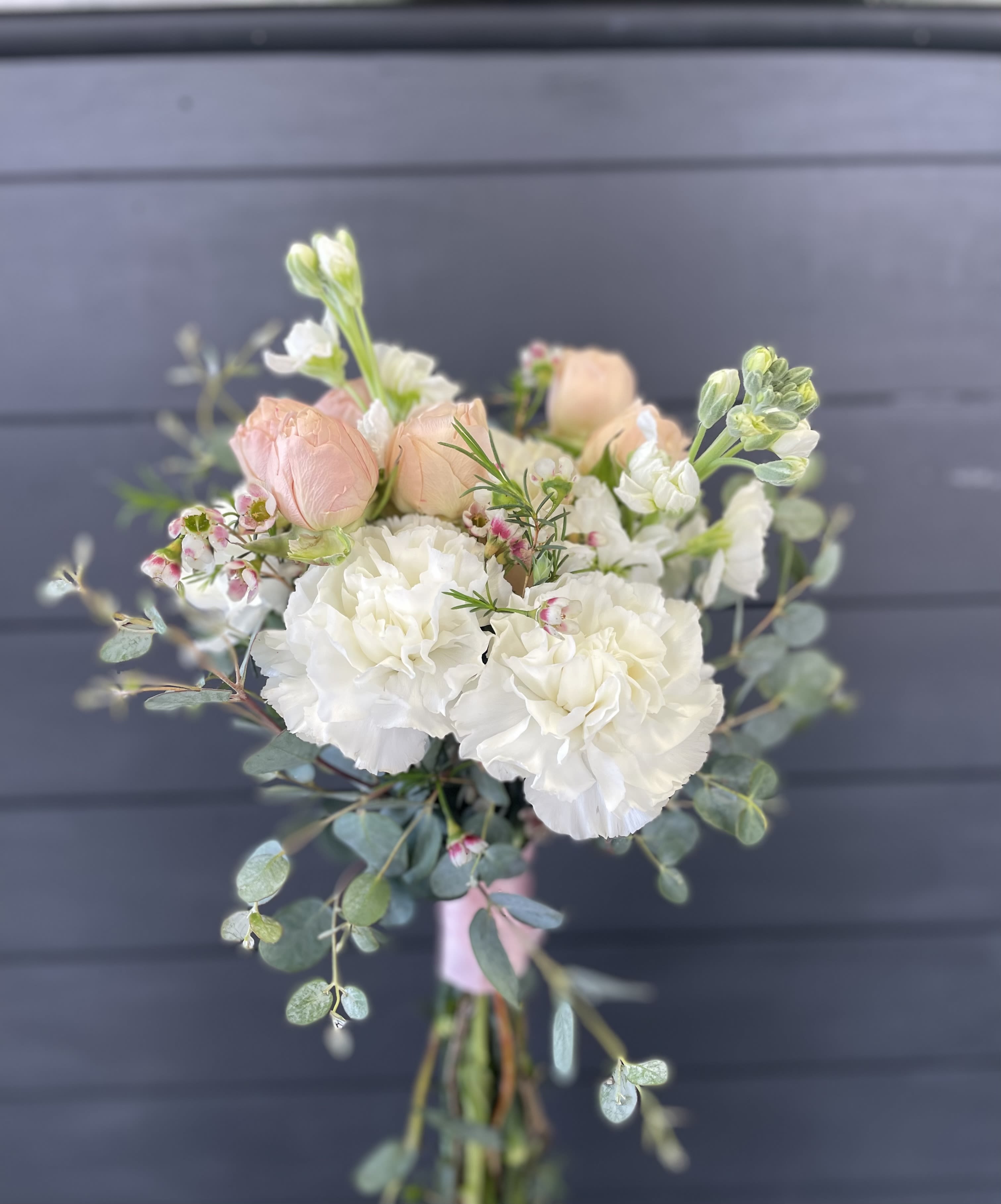 Bouquet of white and blush flowers with eucalyptus