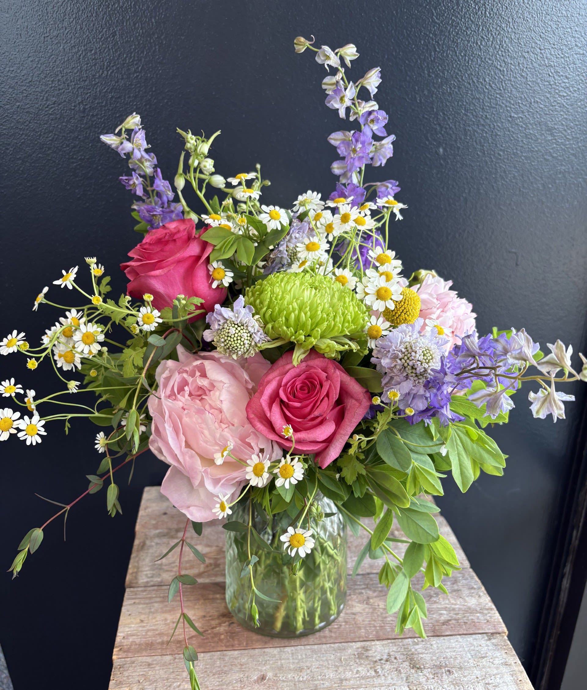 Summer Dreams  - A "Summer Dreams" floral arrangement captures the essence of warm, sunlit days and breezy evenings. It features a soft, romantic color palette with to enhance the airy, whimsical and wispy feel. Colors may vary 