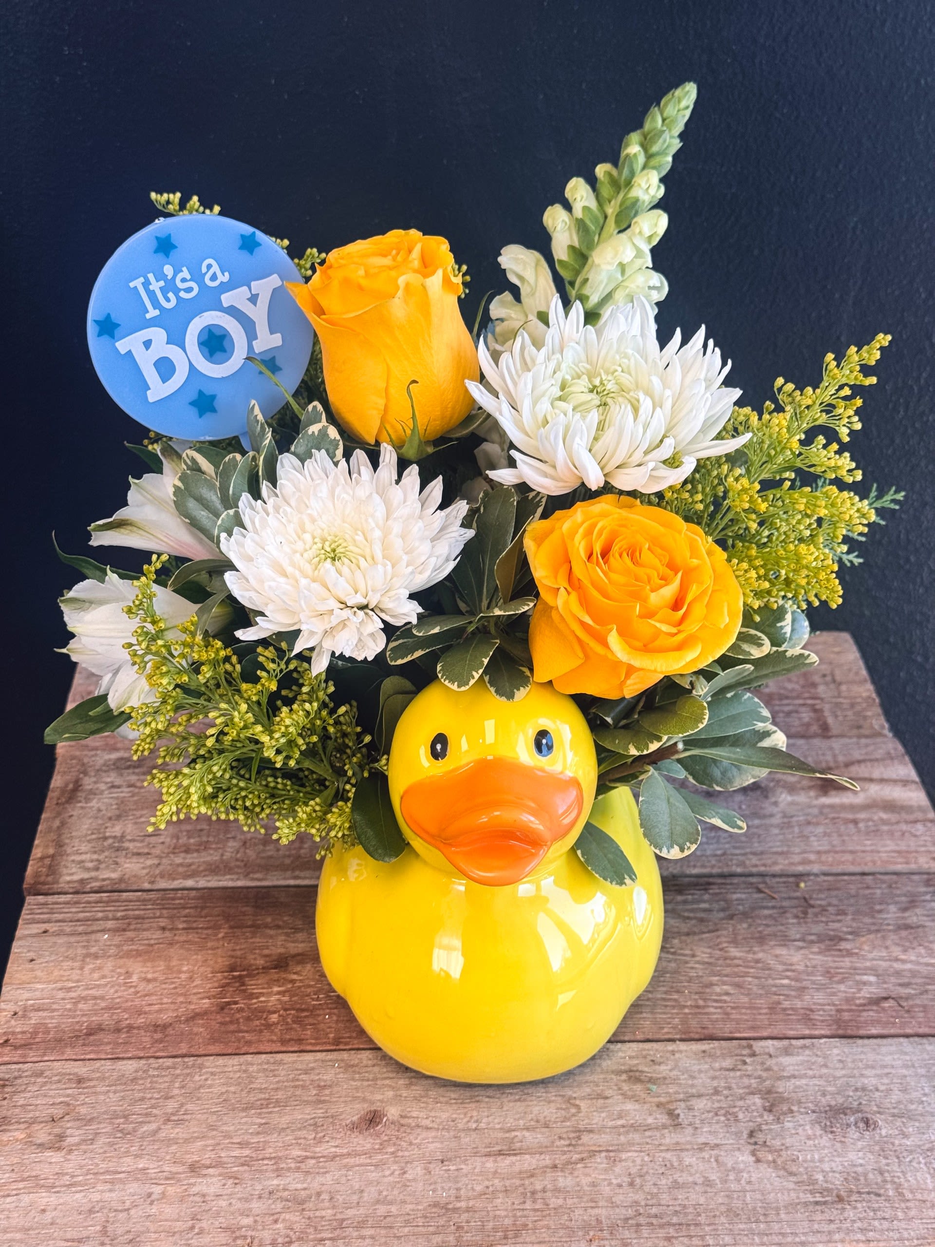 Duck Duck Baby  - A cheerful ceramic duck serves as the base for arrangement that whimsical and tender—perfect for a baby shower, hospital delivery, or nursery decoration. It’s the kind of piece that makes people smile the moment they see it. We can design a version for a boy, girl, or gender‑neutral theme, or tailor it to your needs- add gender to the special instruction box. 