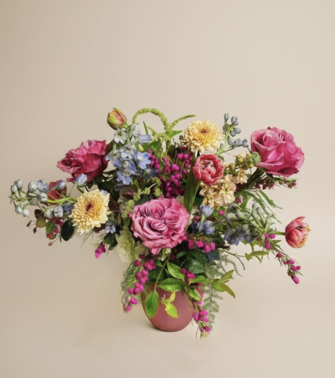May Showers - Spring garden mix. Full petal Pink roses, spots of greens , blues and peach dance throughout this everyday favorite.