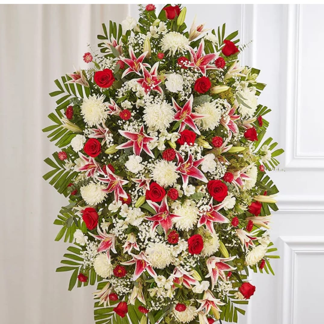 Standing spray of red roses, white mums, and pink lilies