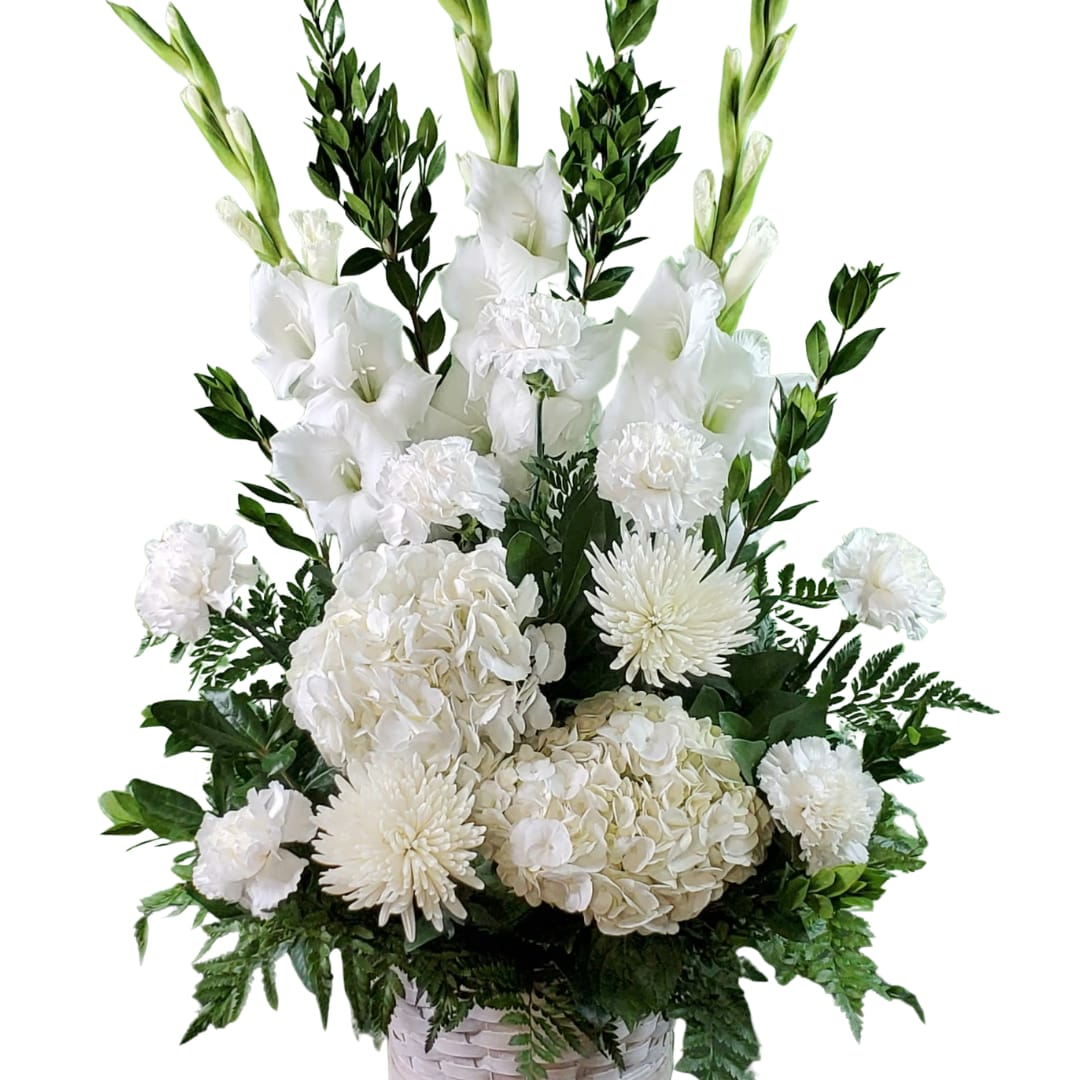 White floral arrangement with gladiolus, hydrangeas, carnations, and mums in a basket
