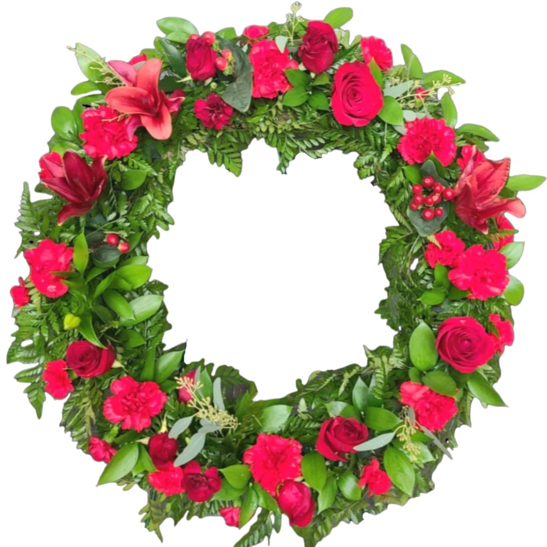 Heart-shaped floral wreath with pink and red flowers on a white background