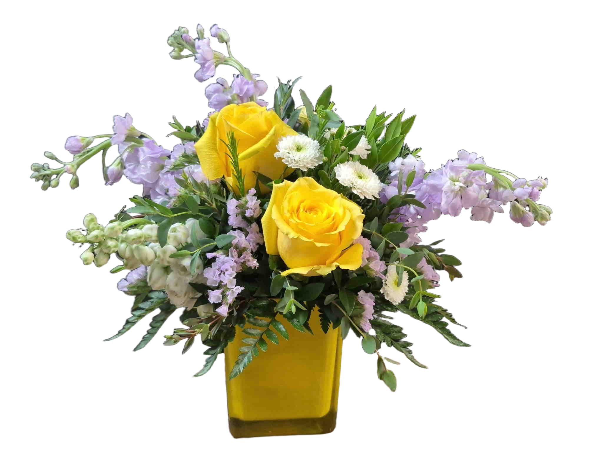 Stylish Spring Bouquet - Bouquet of yellow roses, lavender stock, and white snapdragons arranged in a square glass vase.