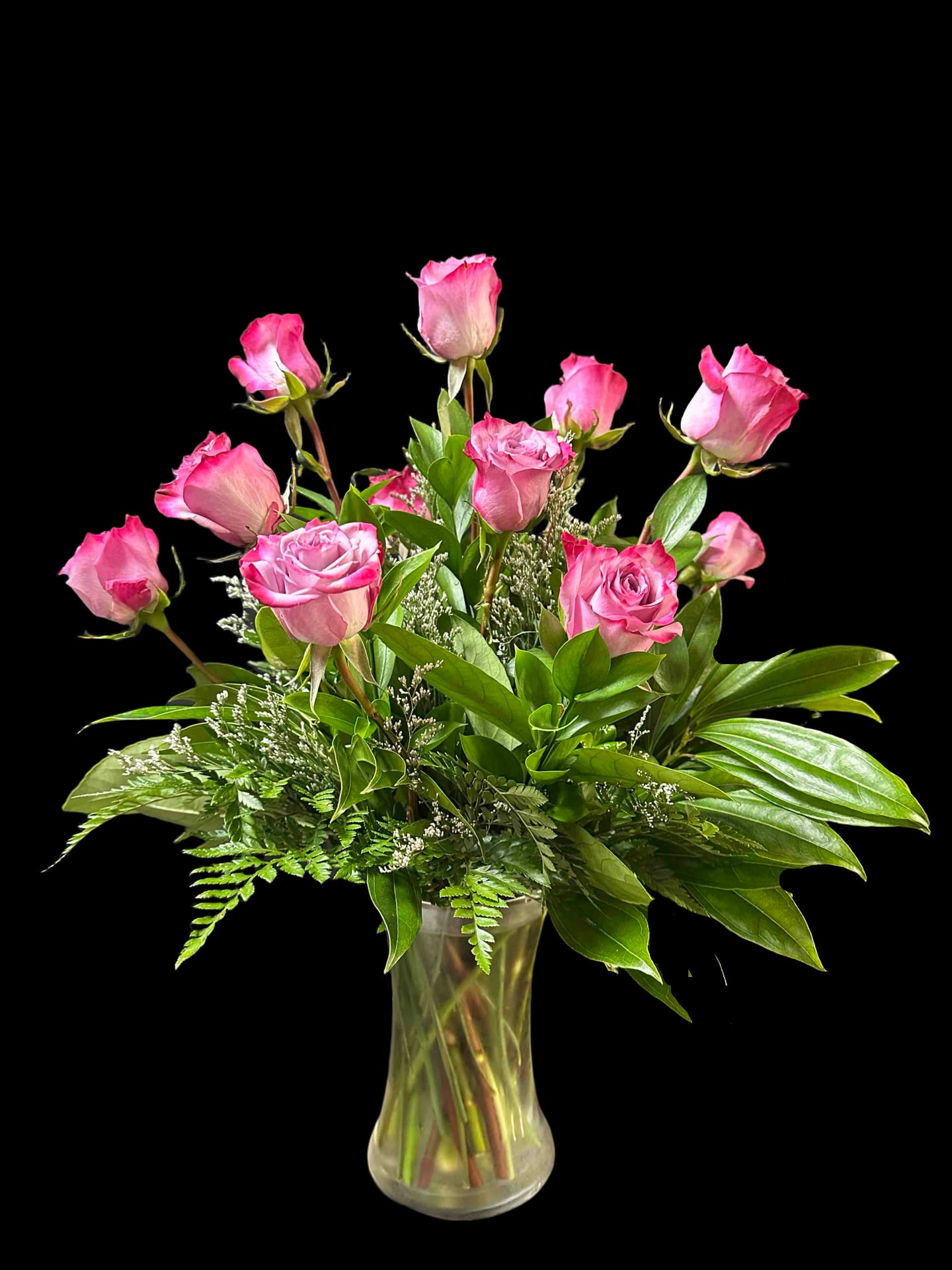 Purple Passion Bouquet - A dozen lavendar roses arranged in a vase.