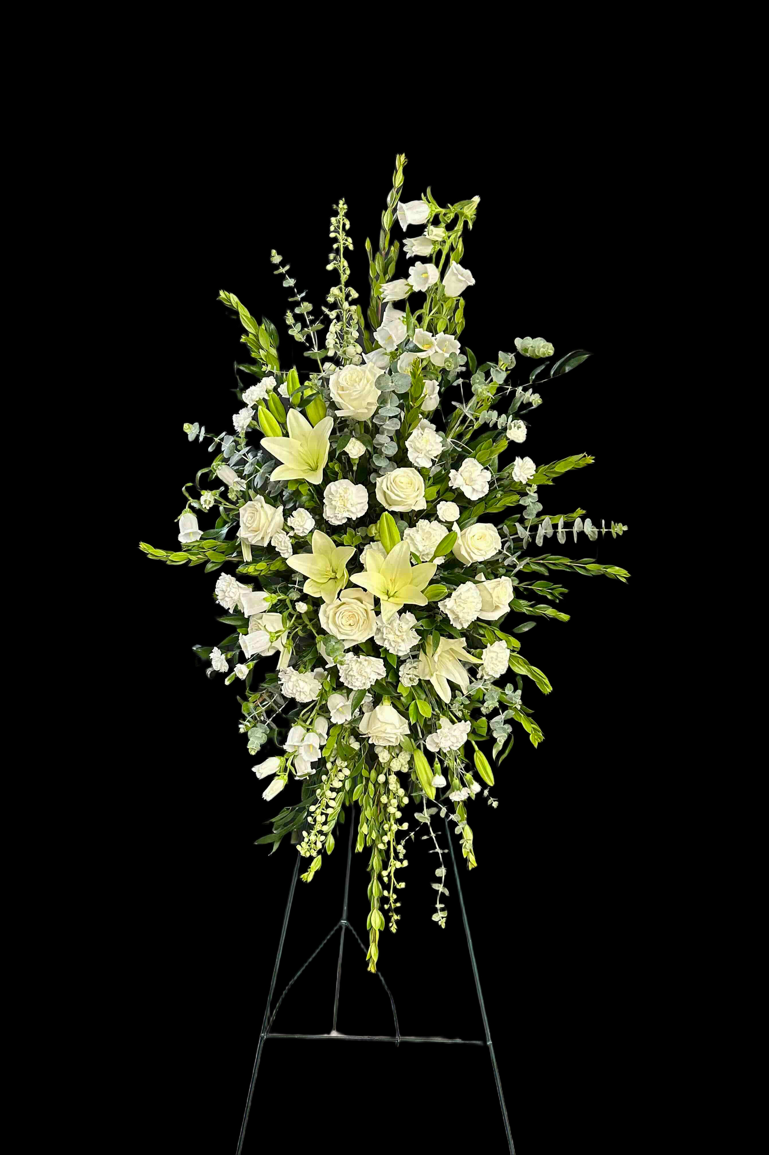 Peaceful Memories - Gorgeous arrangement of white flowers includeing lilies, roses, carnations, and delphinium