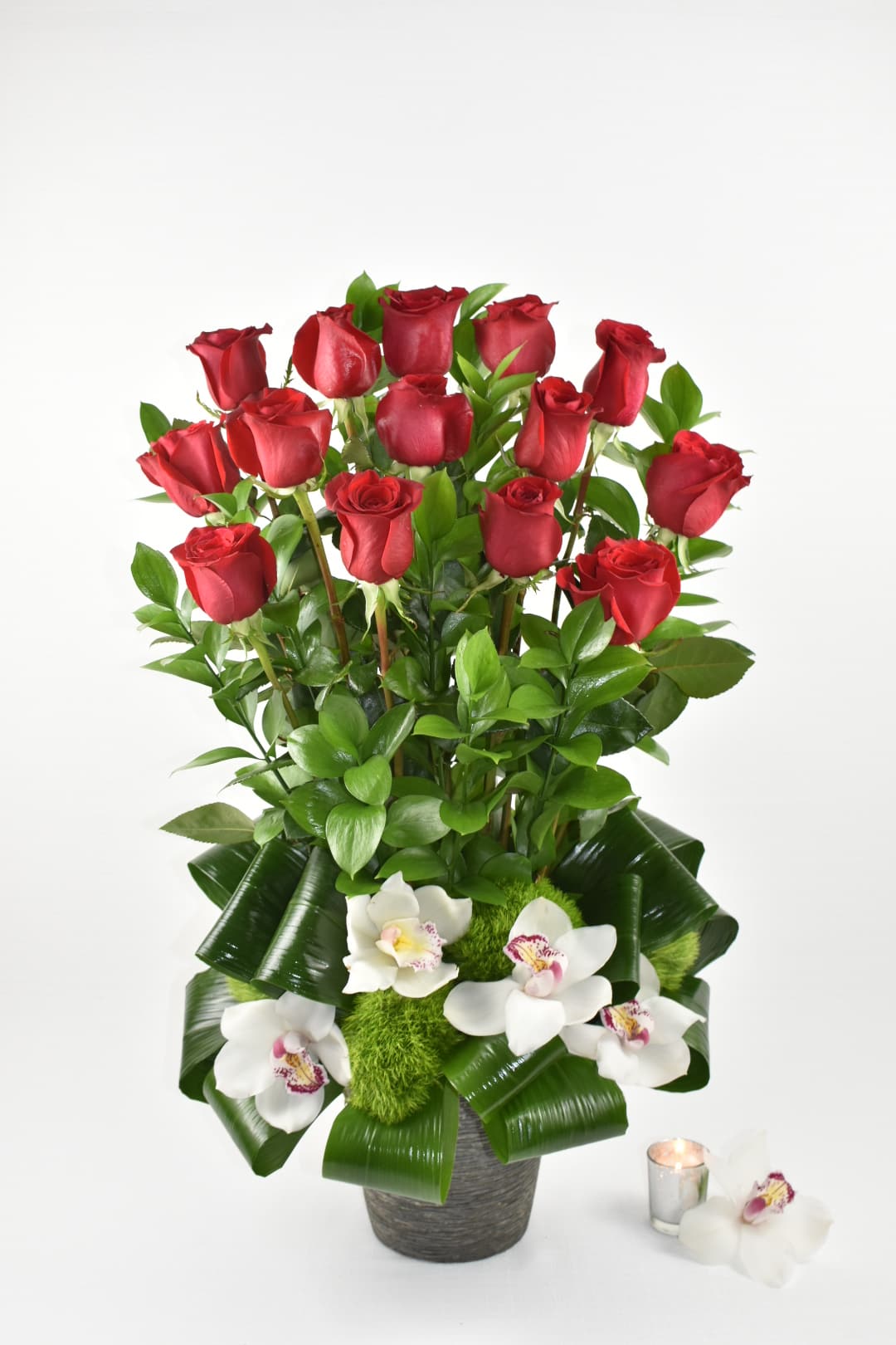 Rosso Amore  - This Beautiful arrangement is in a ceramic vase with Ecuadorian red roses long stems combined with some lovely greenery perfectly combined with some white cymbidium orchids  Perfect for any occasion  and to show your loved to your special someone  Perfect for  birthday flowers anniversary flower  just because flowers  congratulations flowers  Get well flowers  Christmas flowers Valentines Day flowers Mother's Day flowers  