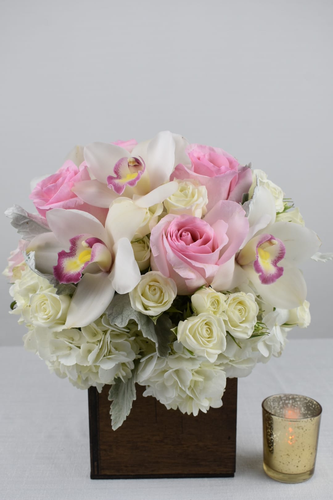 Soft Pink Boxed - 5x5x5 Wood boxed perfectly arranged with some white hydrangeas, Light pink Ecuadorian roses, white spray roses, white cymbidium orchids and a perfect touch of dusty miller. This Arrangement is the perfect gift for any occasion. 
