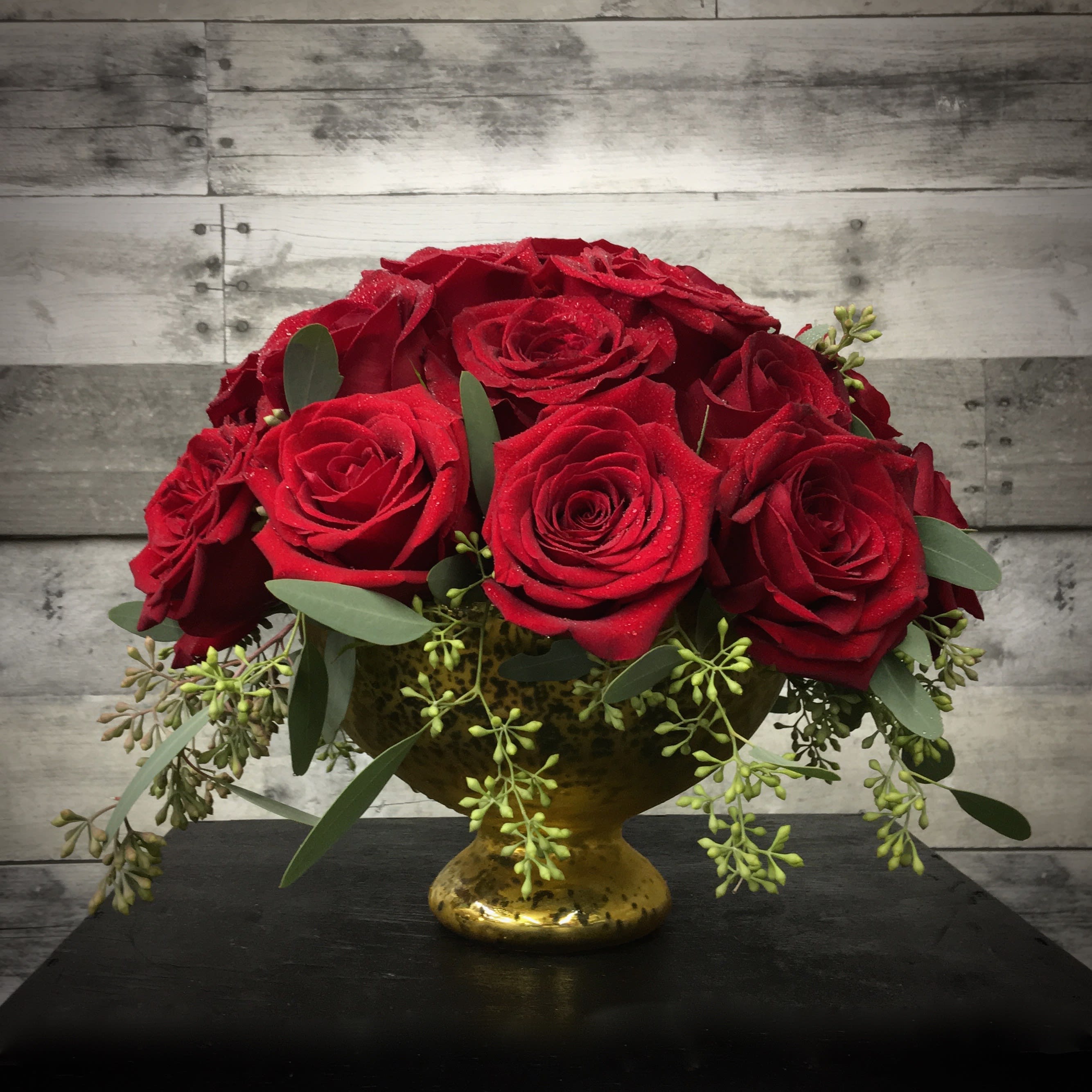 The Dolly Madison - A lush cluster of  30 Red Roses in a Mercury Glass bowl with seeded eucalyptus accents.   This stunning piece is sure to warm the heart of your loved one. Named after our fourth FLOTUS who was know as the most successful hostess.  Don't want Red Roses?  Just let us know in the special instructions what your preferred color is.  Due to product availability, container may vary.