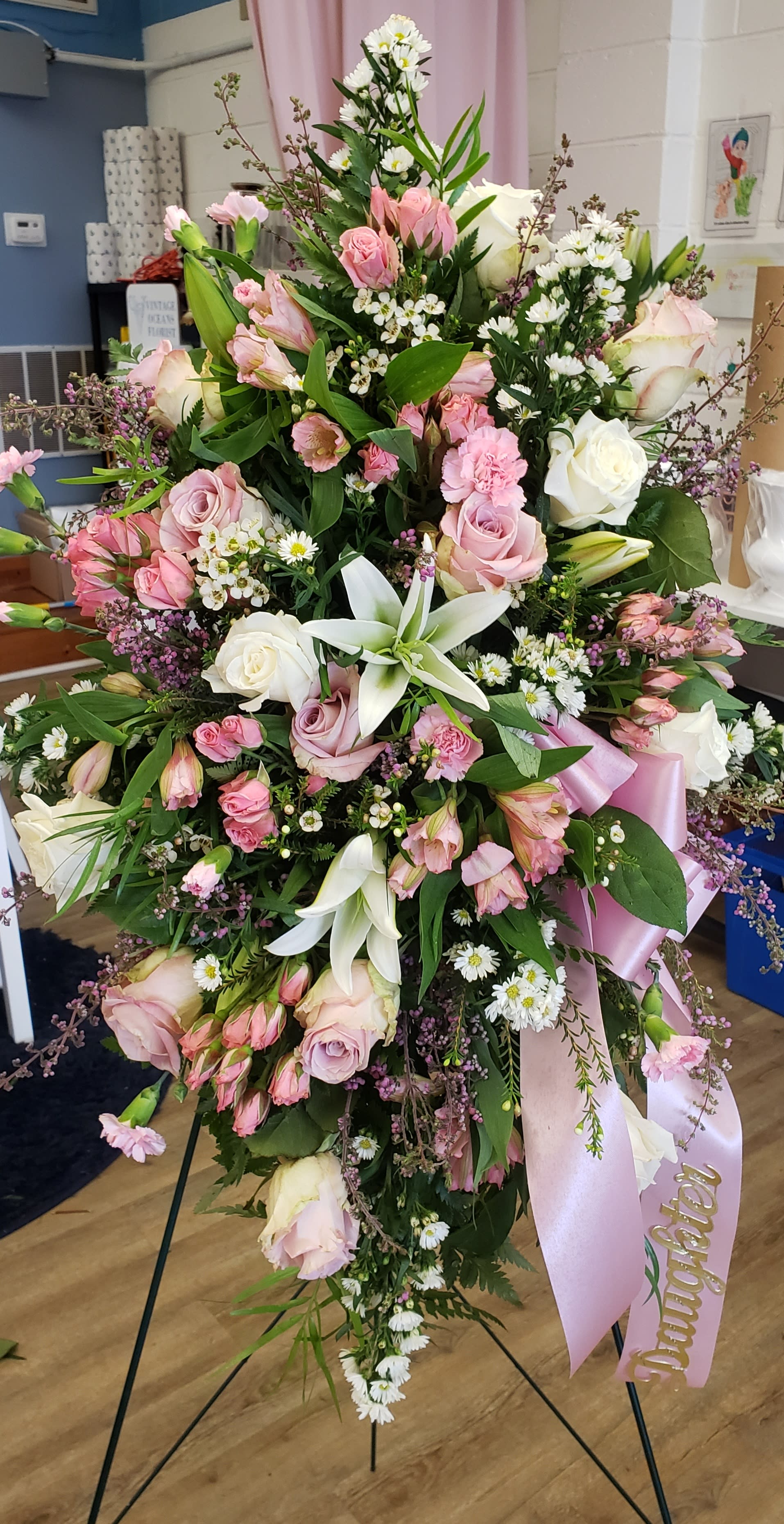 Large pink and white floral standing spray with ribbon