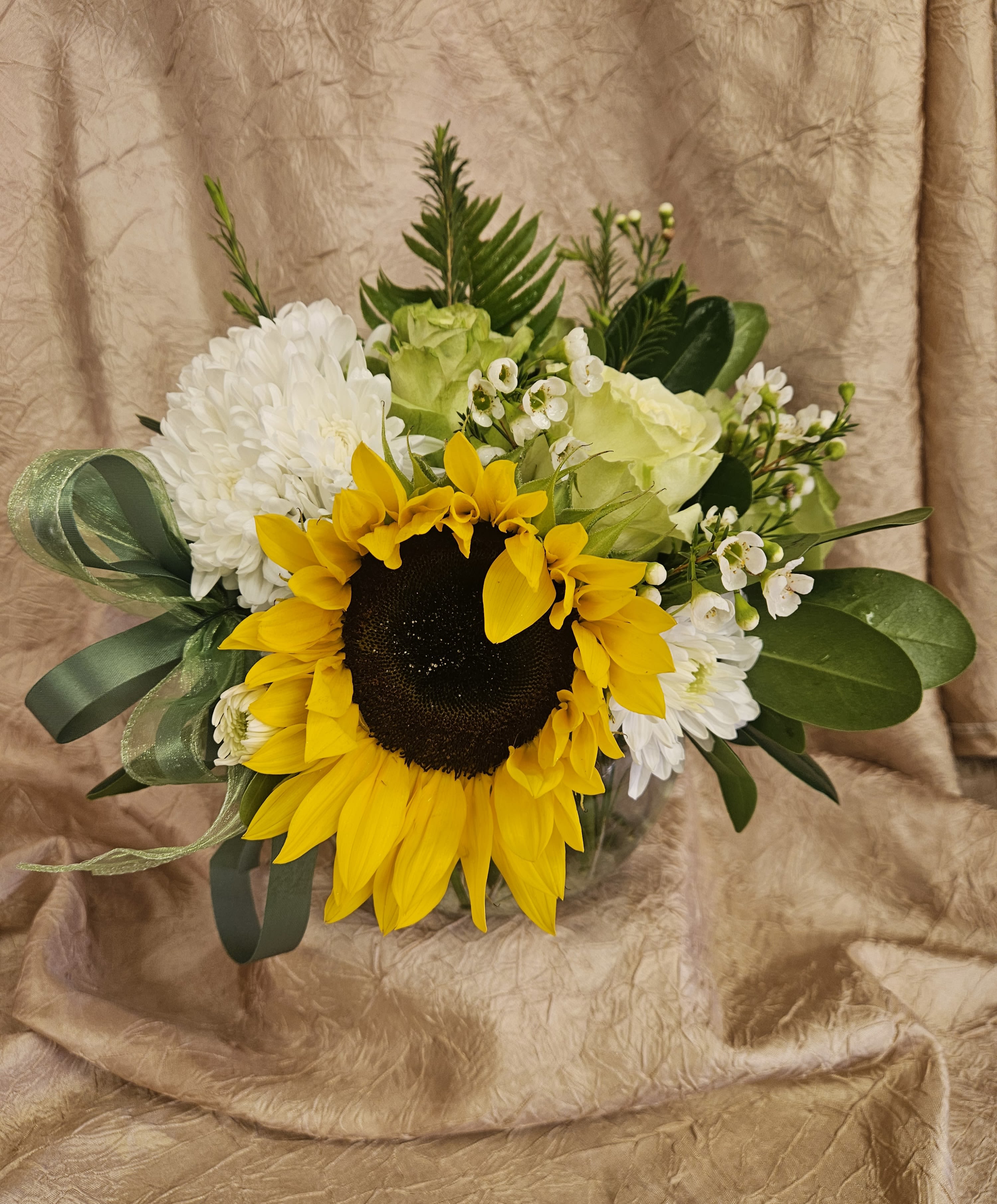 Sunflower bouquet with white blooms and green ribbon