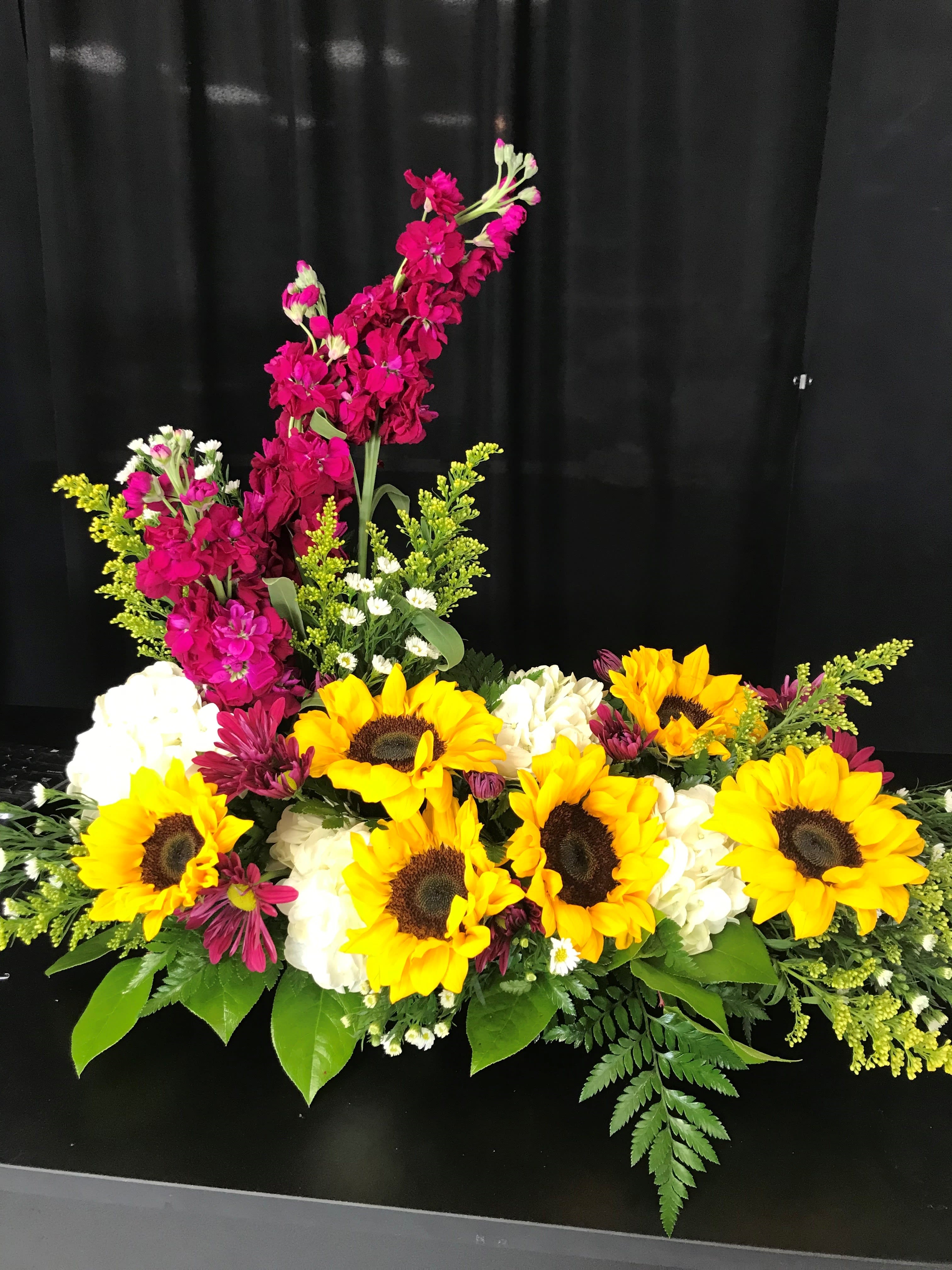 Bright sunflower arrangement with white blooms and magenta flowers