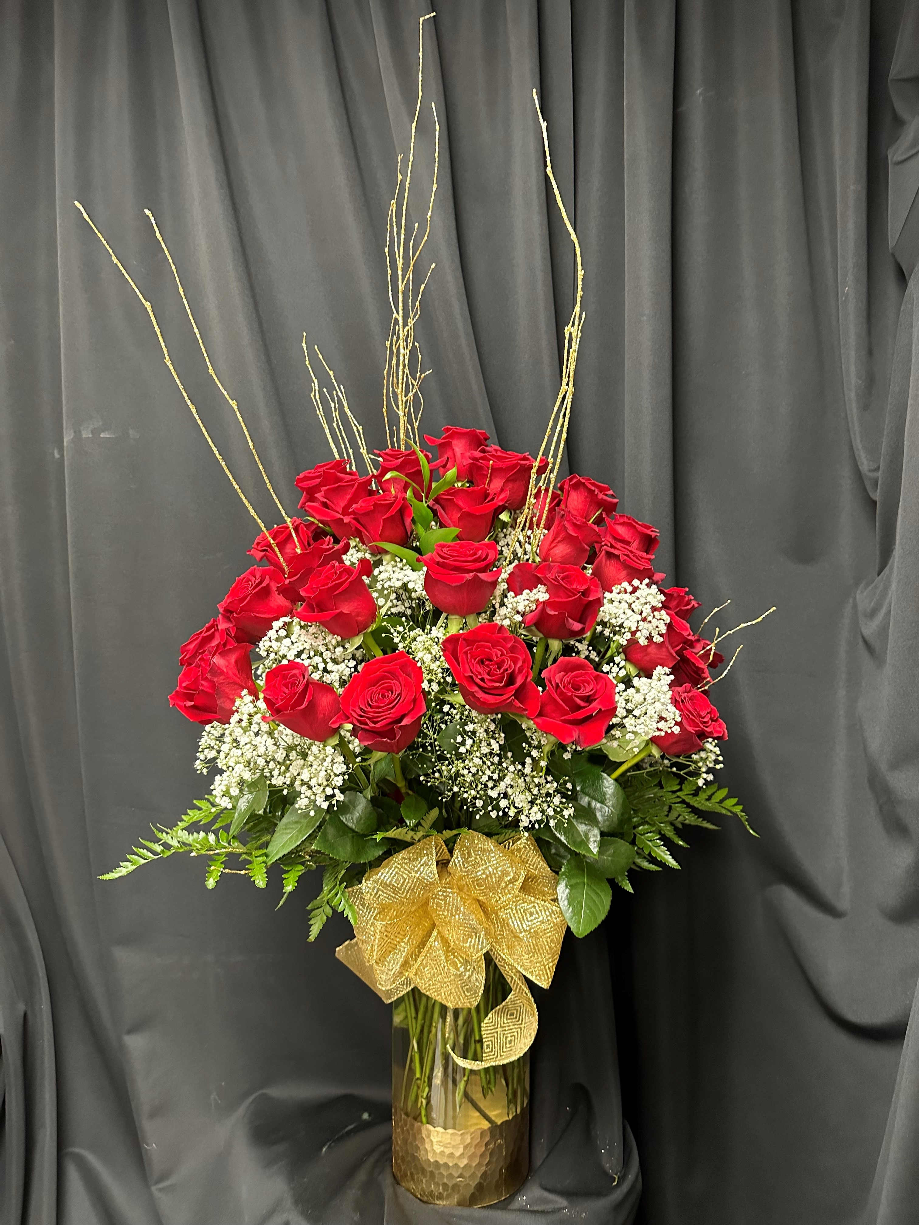 Luxury Rose Bouquet - Embrace the serendipity of love with this breathtaking bouquet, destined to capture the essence of your heartfelt connection. A lavish arrangement of 48 premium long-stemmed red roses, elegantly nestled in a superior gold-dipped glass vase, serves as a radiant symbol of your enduring affection
