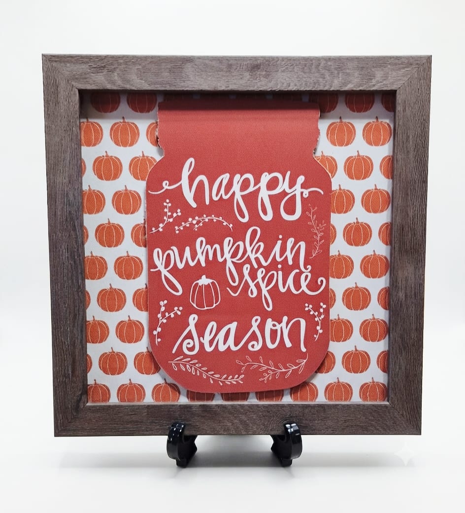 Framed fall sign reading "happy pumpkin spice season" with pumpkin pattern