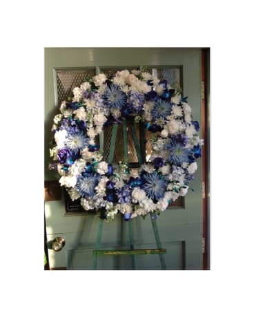 Blue and white floral wreath on a door