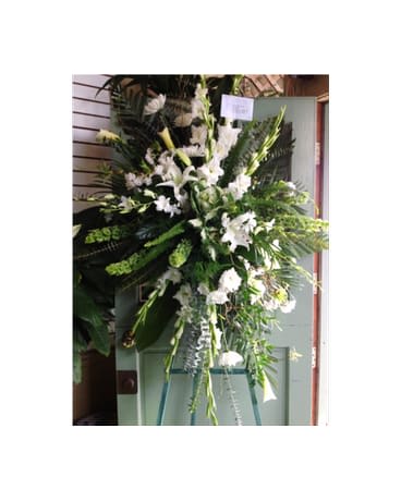 Tall white floral standing spray on an easel
