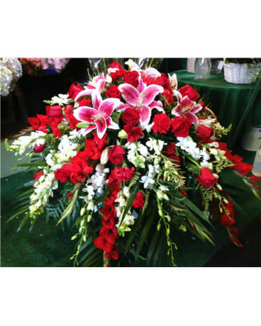 Large red and white floral spray with pink lilies