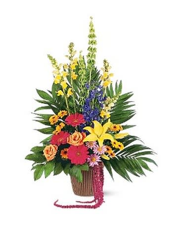 Tropical flower arrangement in a basket with bright mixed blooms