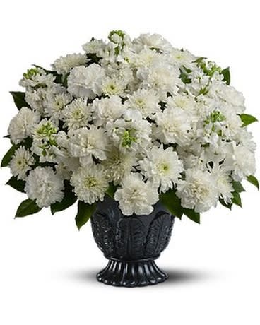 White chrysanthemum bouquet in a black urn vase