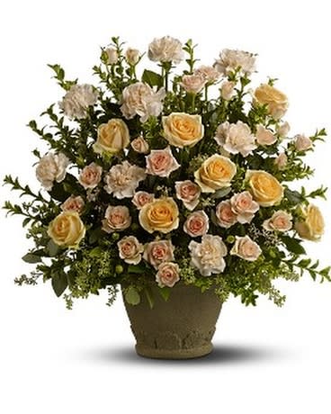 Arrangement of pale roses and carnations in a brown pot