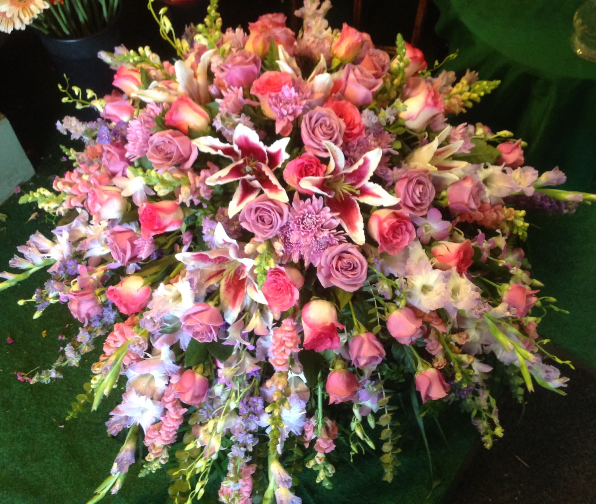 Large pink and lavender floral spray with roses and lilies