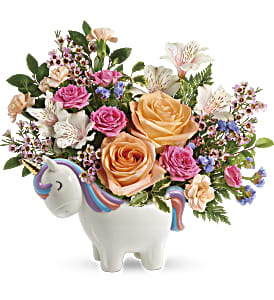 Floral arrangement in a unicorn-shaped ceramic container