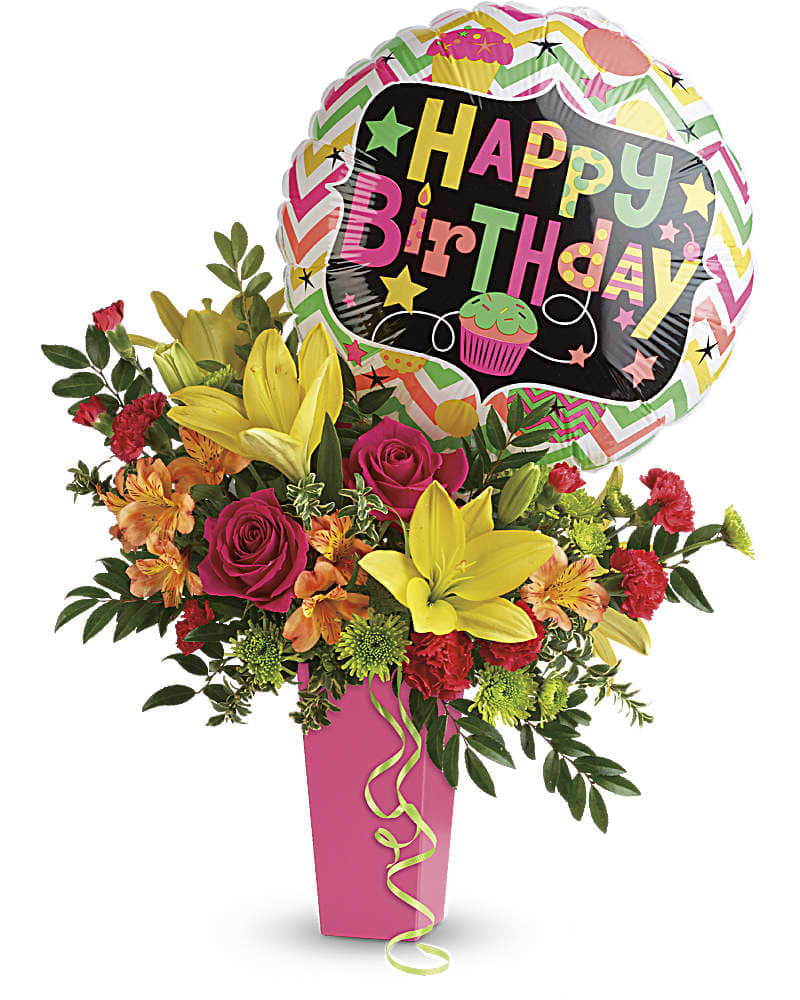Tall birthday flower arrangement with yellow lilies, pink roses, and a Happy Birthday balloon in a pink vase
