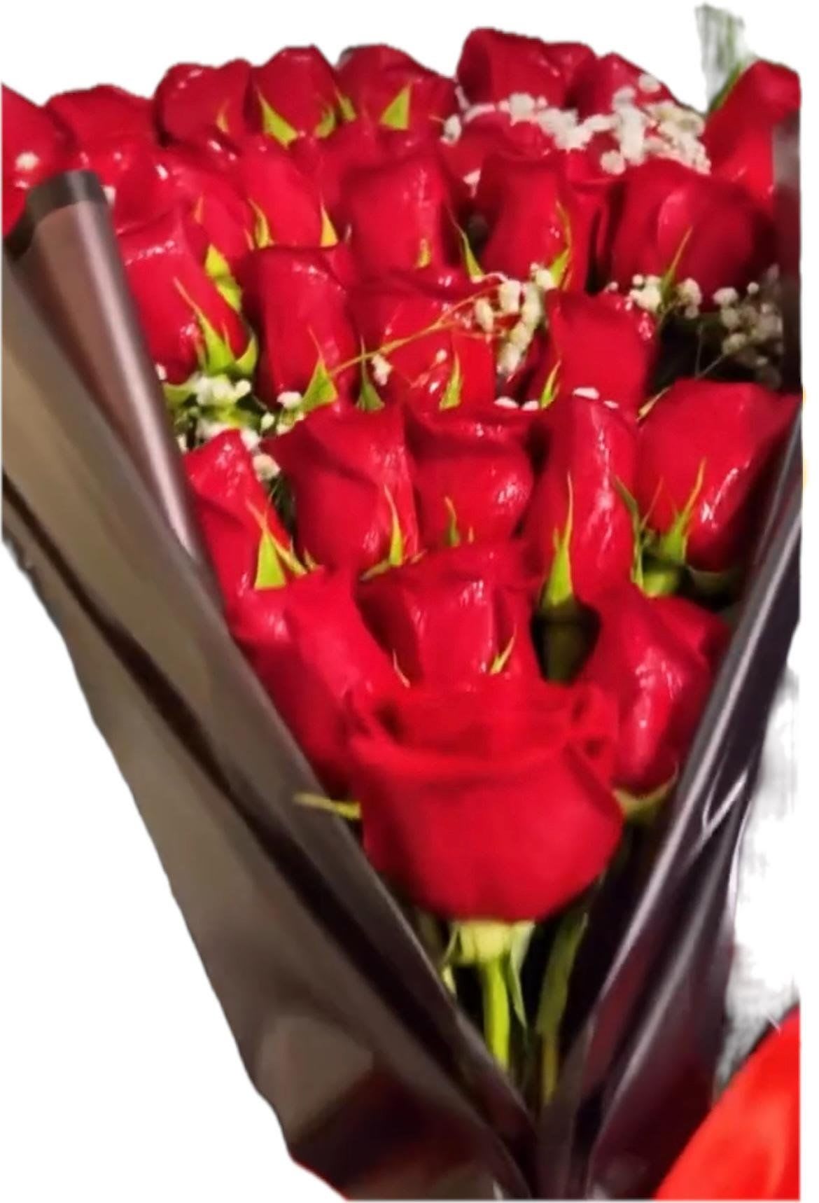 Bouquet of red roses wrapped in dark paper