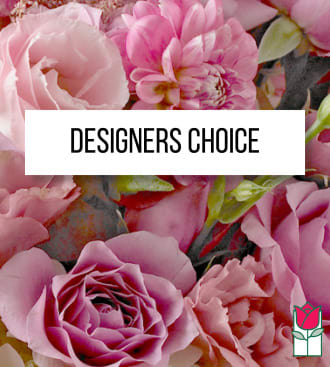 Pink roses and peony-like blooms behind a Designers Choice label