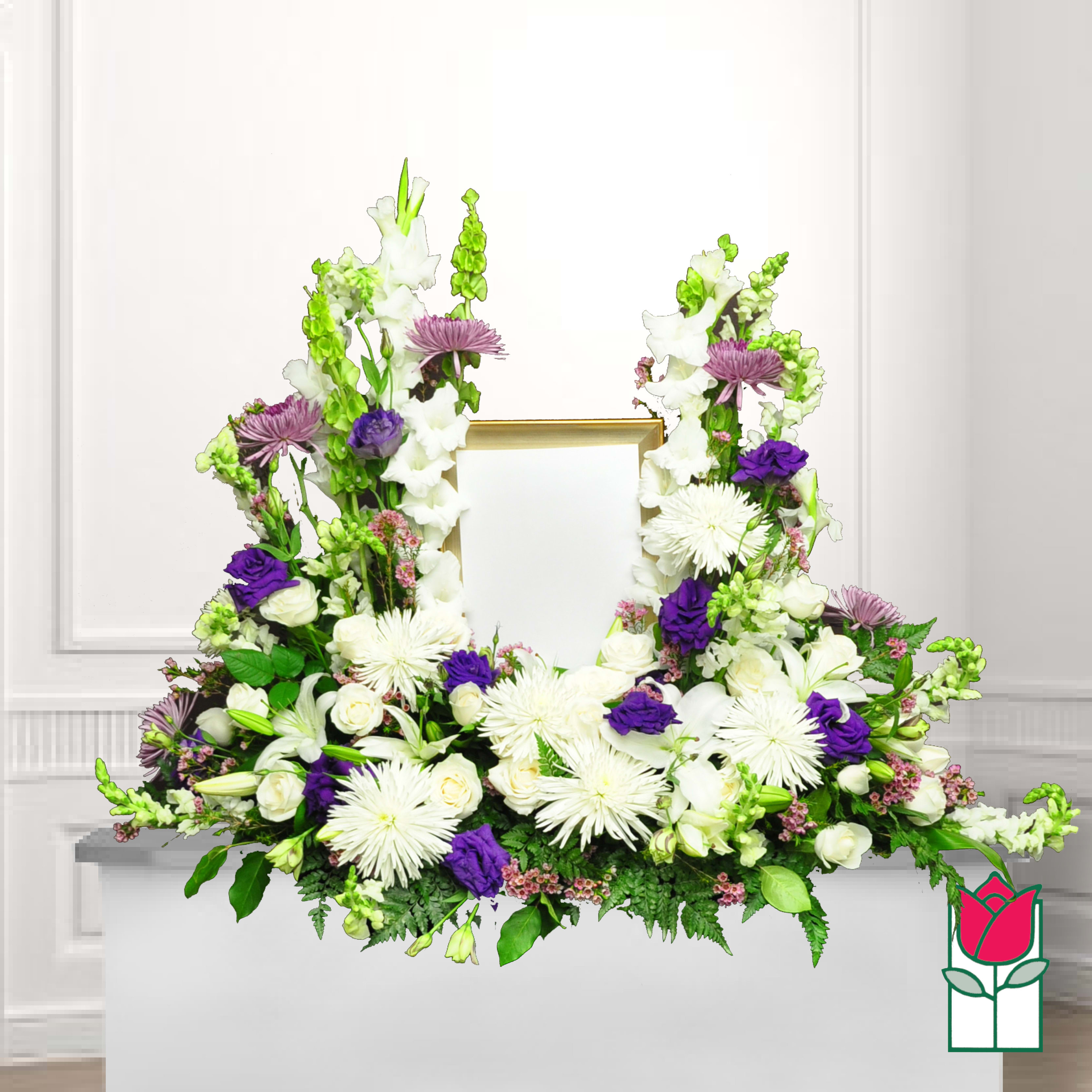 White and purple floral funeral frame arrangement with a gold photo opening
