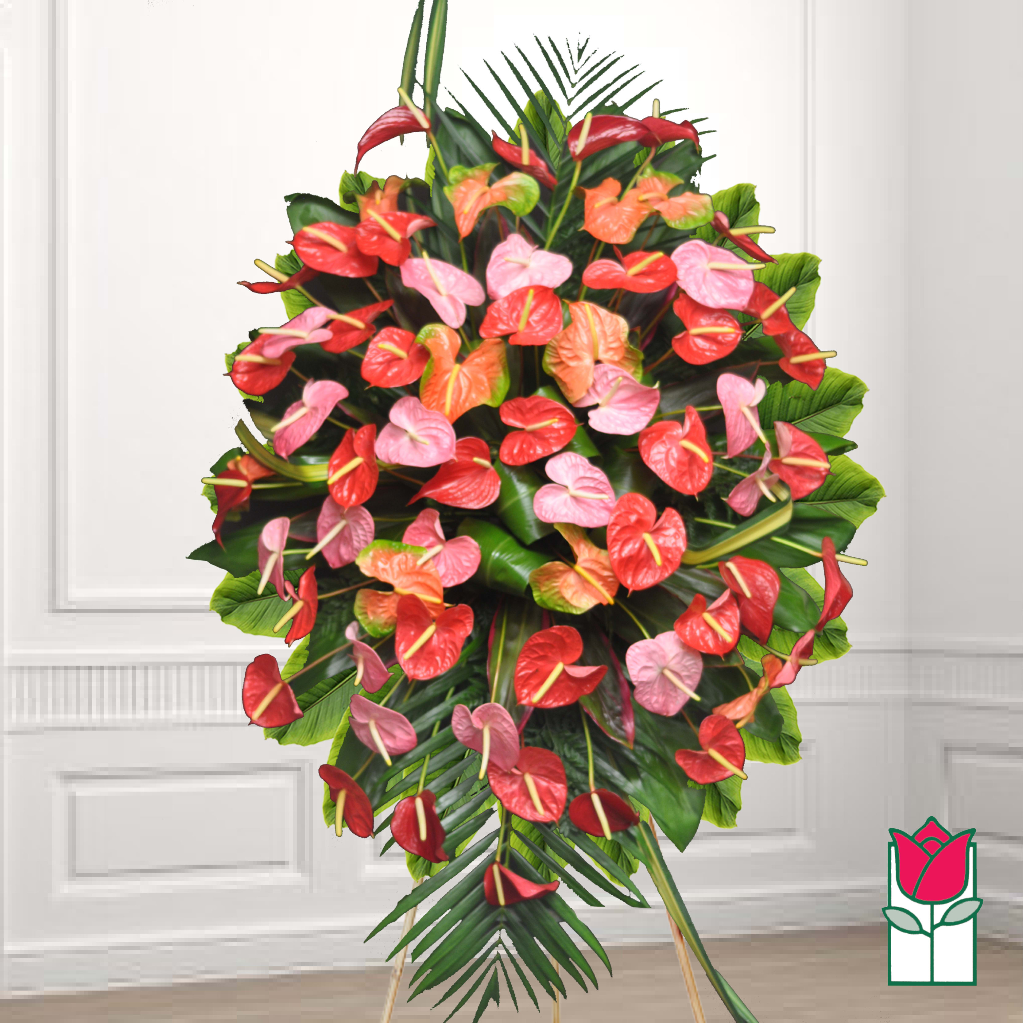 Standing floral spray with red, pink, and orange anthuriums